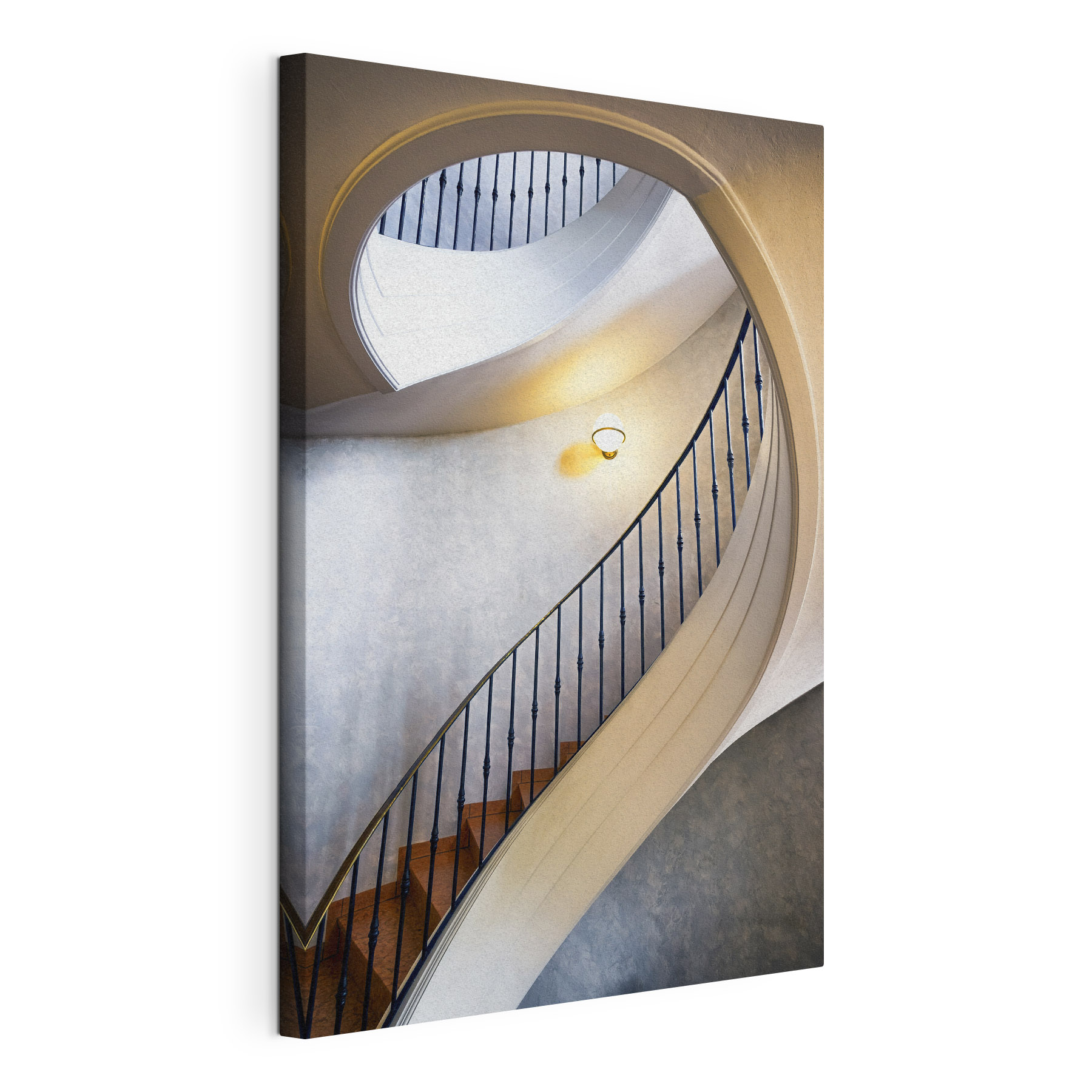 A spiral staircase with a black railing A spiral staircase with a black railing