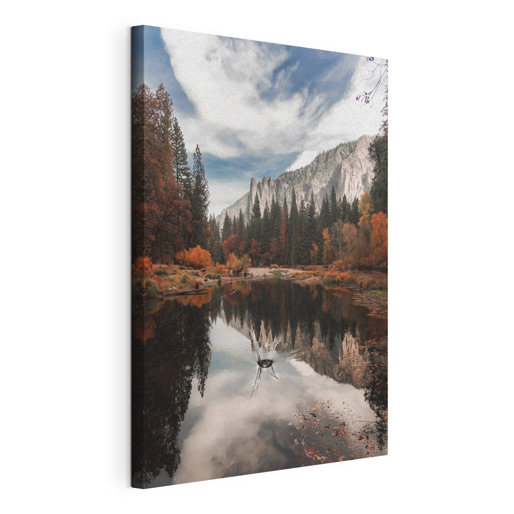 A lake surrounded by trees and mountains A lake surrounded by trees and mountains
