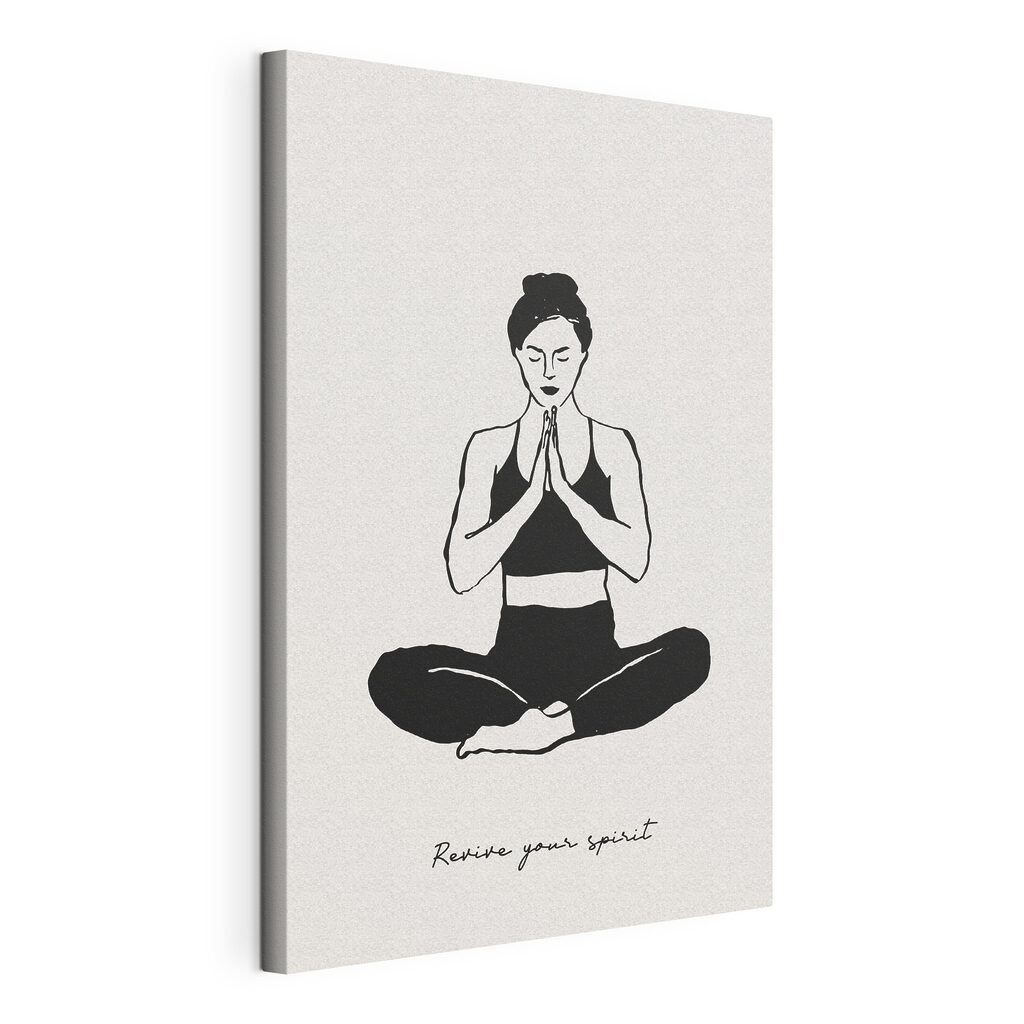 A woman sitting cross legged with her hands together