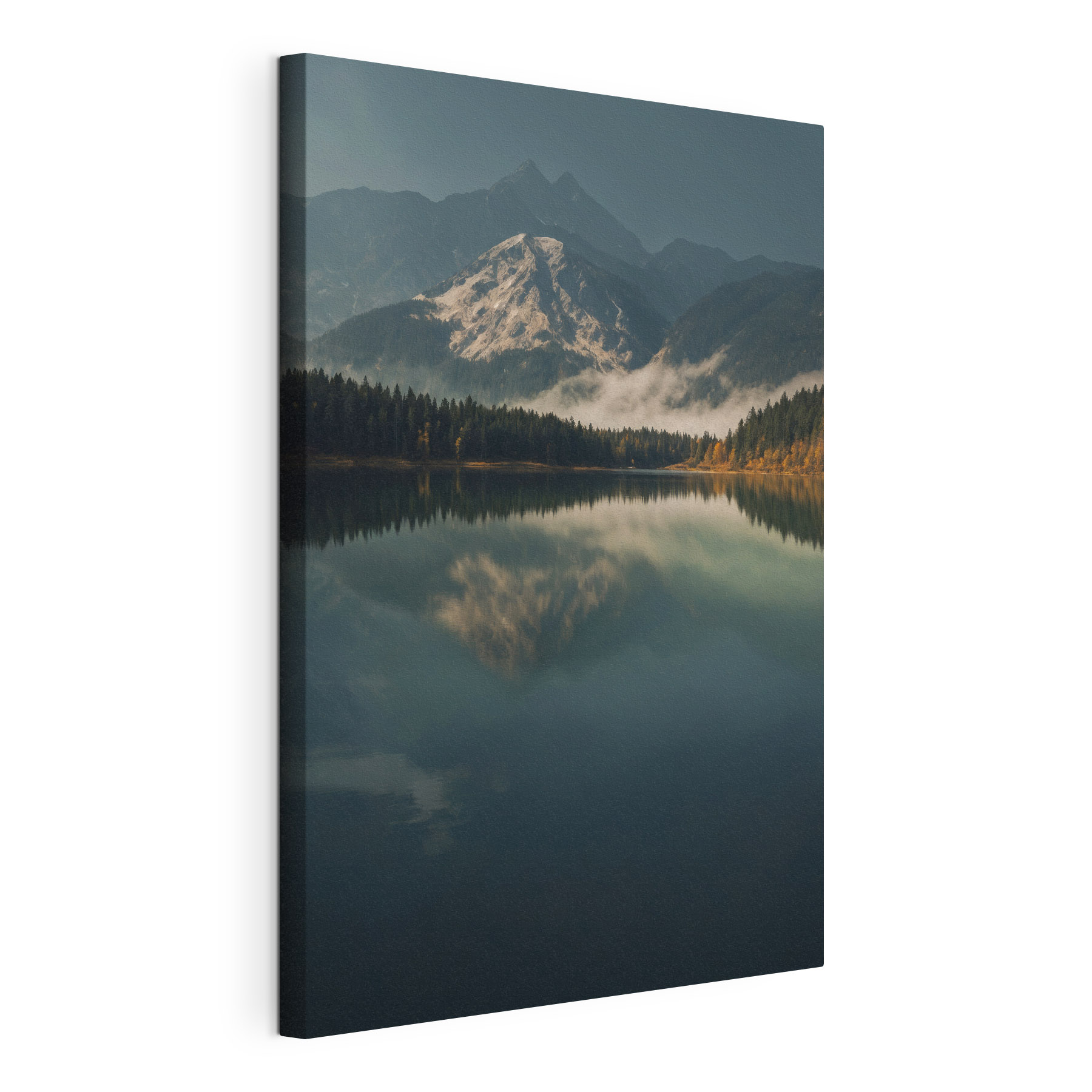 Lake with trees and mountains in the background