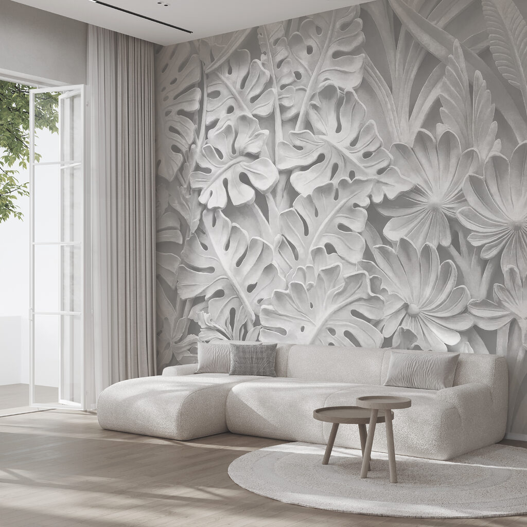 Pared blanca con flores y hojas
