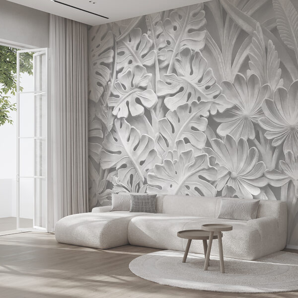 Pared blanca con flores y hojas