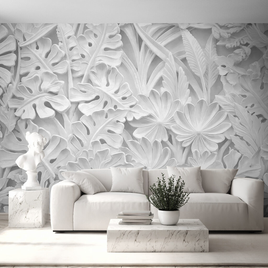 Pared blanca con flores y hojas
